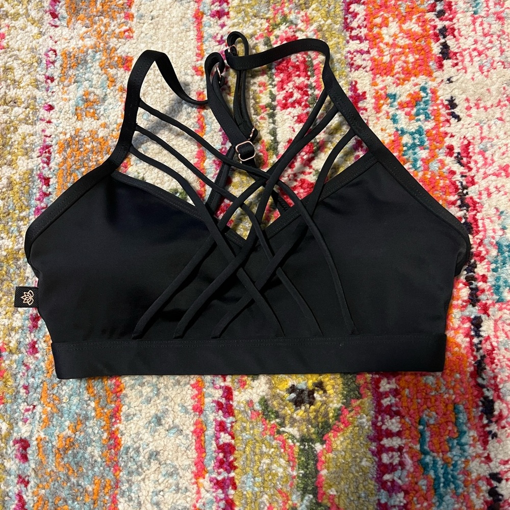Unique black sports bra w/ cross cross details, XS, worn once! sold on Carbon38